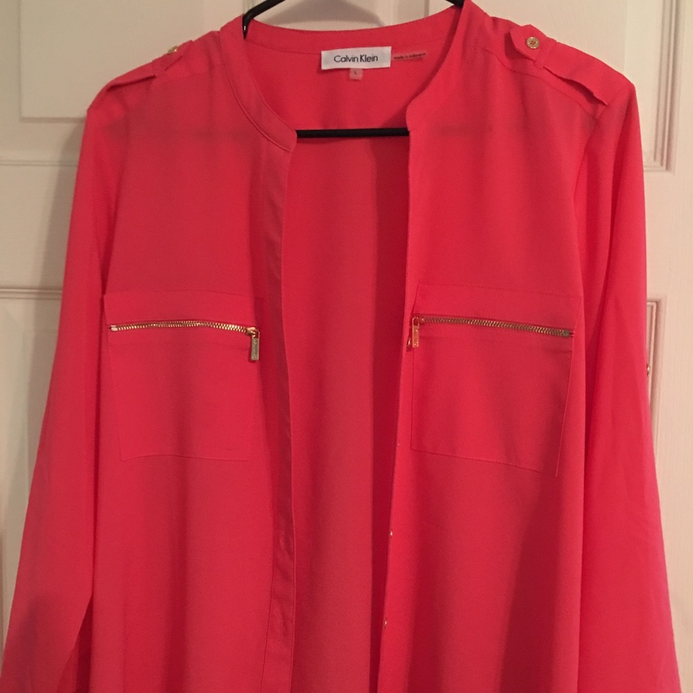 Woman’s coral Calvin Klein blouse .  Size large 🌺